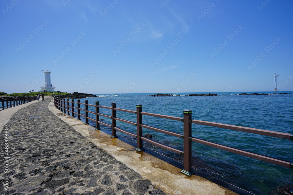seaside walkway and lighthouse
