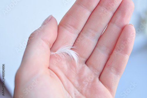 close up of a female hand holding a finger