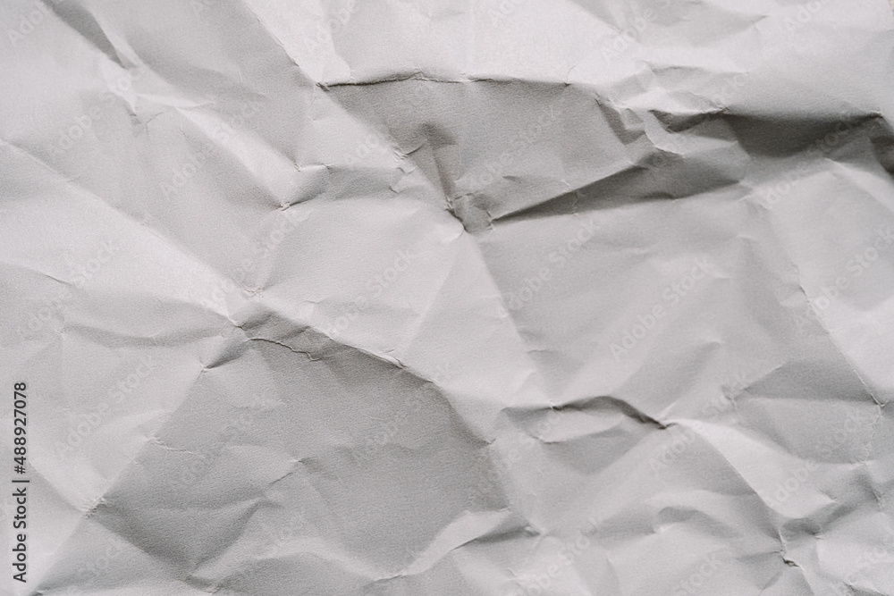 The crumpled gray paper texture. The crumpled gray paper texture.