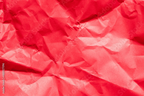 The crumpled red paper texture.