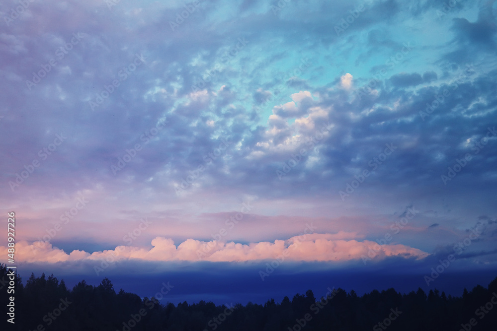 High clouds in the summer sky. Sky background. Meteorological observations of the sky.