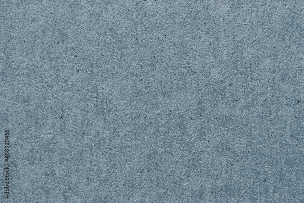 A sheet of dark gray recycled paper or cardboard texture as background A sheet of dark gray recycled paper or cardboard texture as background