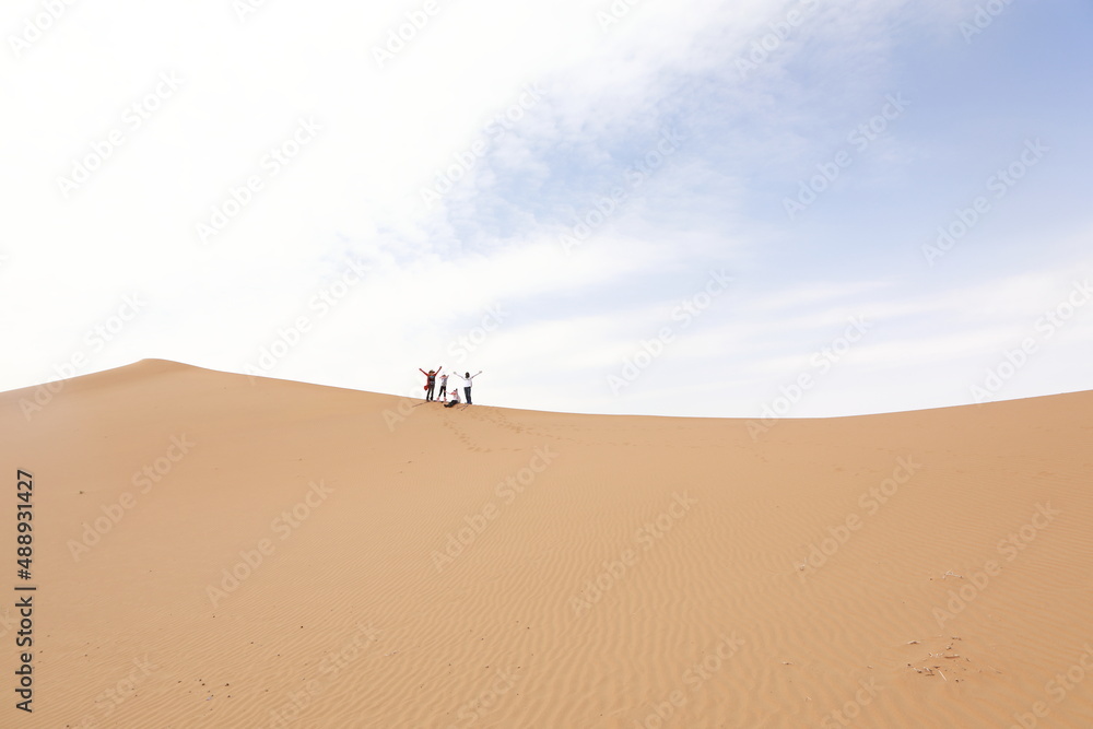 Chinese tourists trekking in Alxa desert