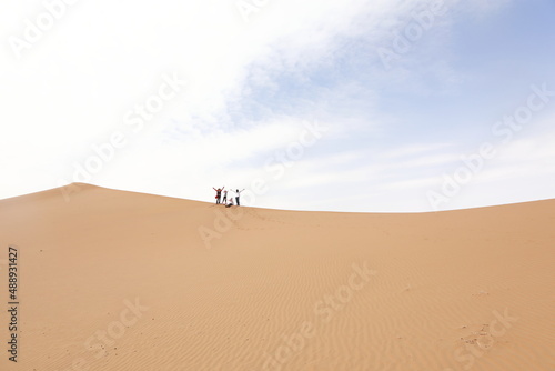 Chinese tourists trekking in Alxa desert