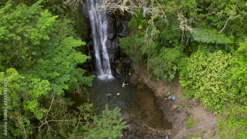 Aerial view of people swimming in a waterfall in the jungle, Top down Wide Shot. Central America. Aerial view of people swimming in a waterfall in the jungle, Top down Wide Shot. Central America.