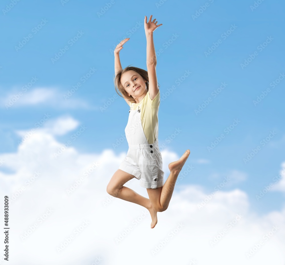 Happy lucky school girl jumping and smiling Happy lucky school girl jumping and smiling