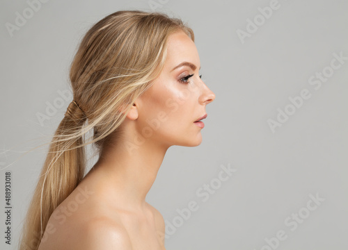 Woman Face Profile. Young Girl Portrait with Smooth healthy Skin. Model Facial Side View over Gray. Body and Neck Skin Care Cosmetology