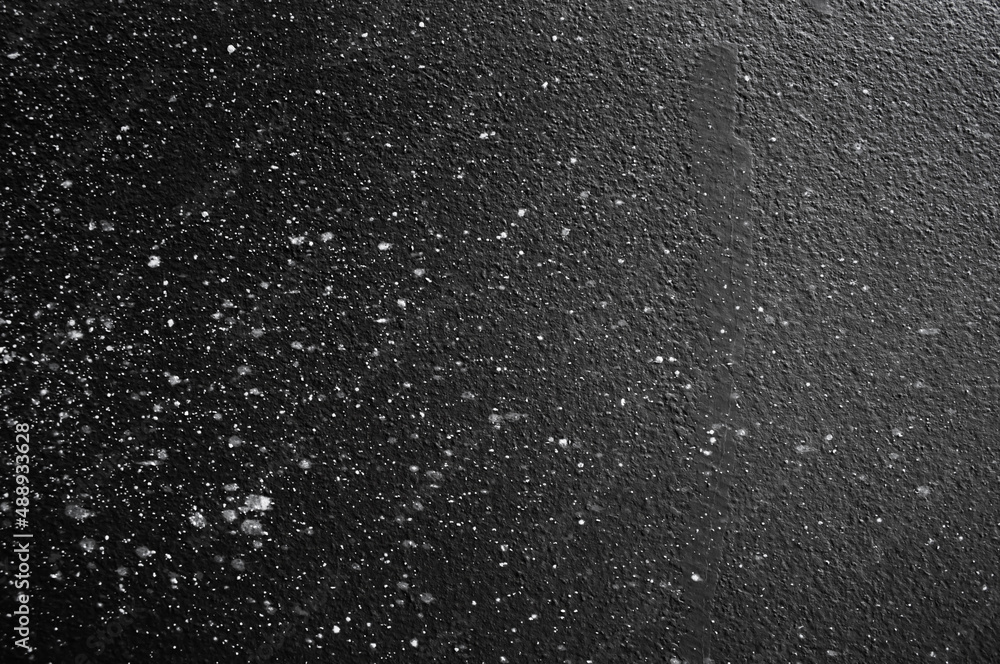 Wall panel grunge black or dark grey concrete background.Backdrop Dirty,dust black wall concrete,cement blackboard texture and splash brush stroke for architecture or abstract background.Soft focus.