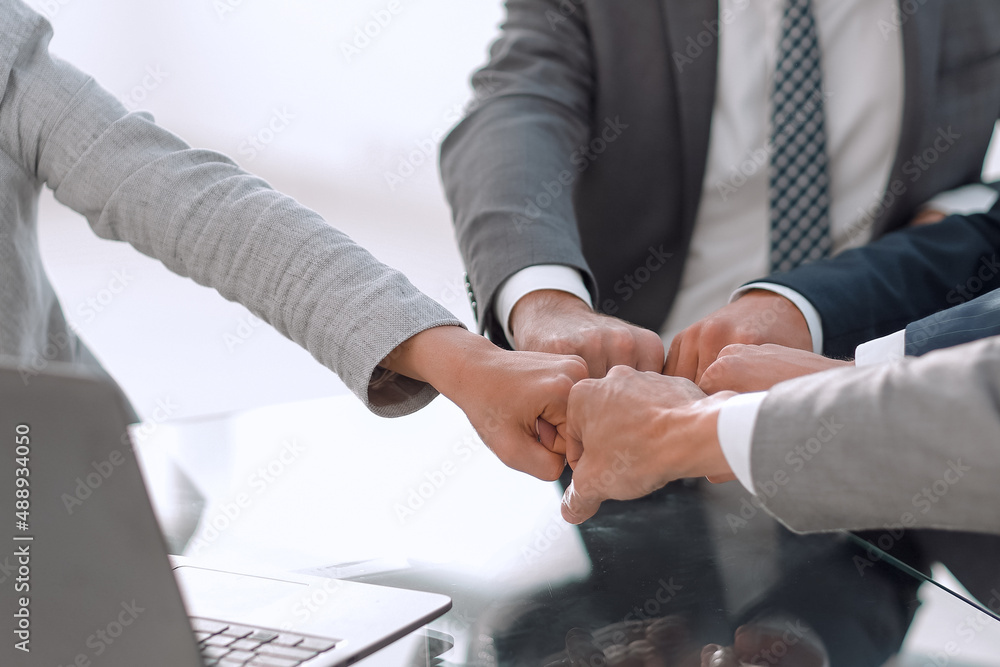 business team working together in office business team working together in office