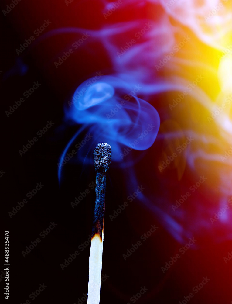 Wooden match burning on a black Wooden match burning on a black