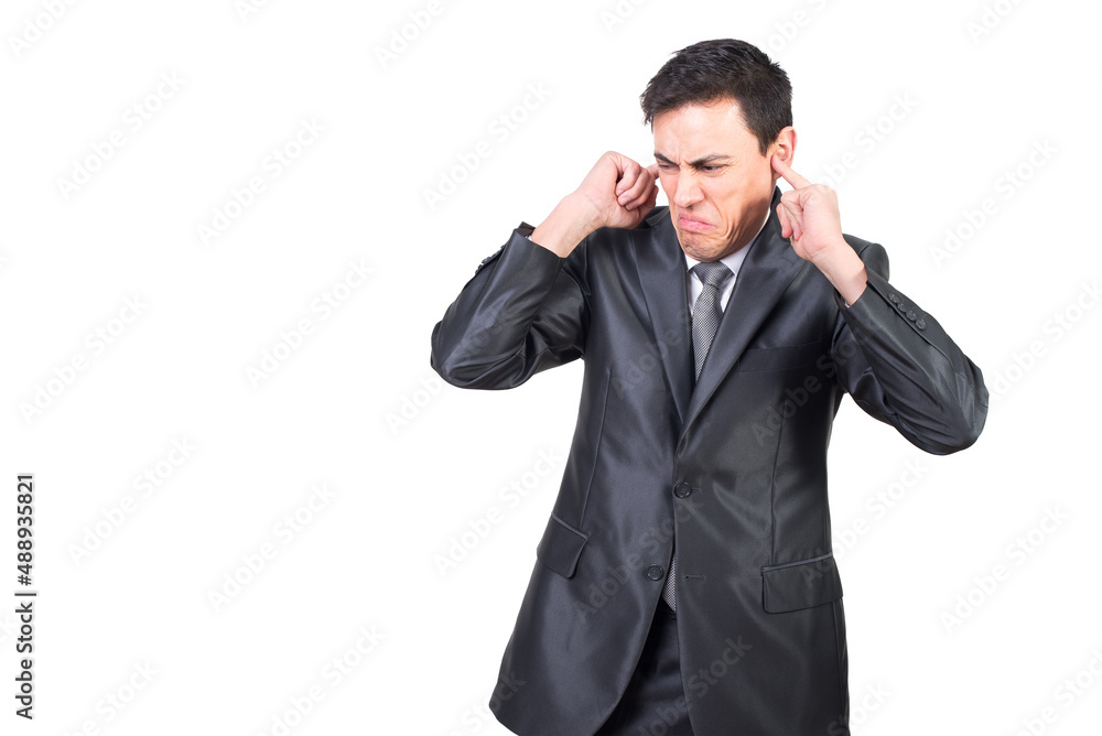 Annoyed businessman in suit covering ears with fingers Annoyed businessman in suit covering ears with fingers
