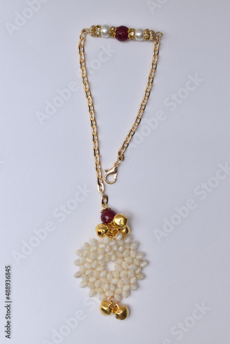 beautiful lumba rakhi on the occasion of raksha bandhan over white background with beads