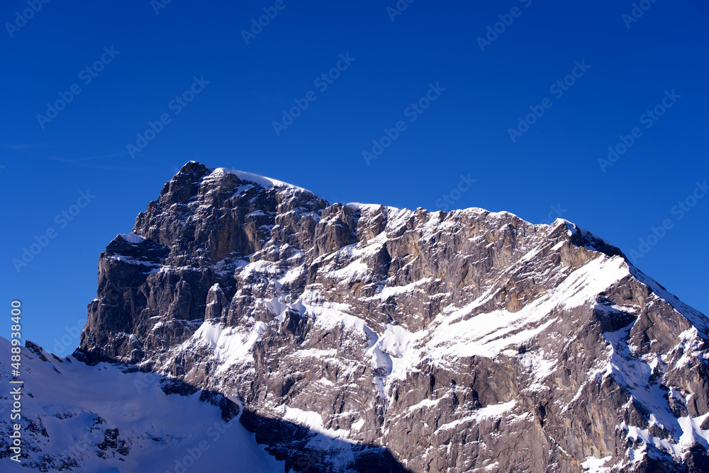Famous Mount Titlis 3,238 meters above sea level at ski resort Engelberg in the Swiss Alps on a sunny winter day. Photo taken February 9th, 2022, Engelberg, Switzerland. - obrazy, fototapety, plakaty 