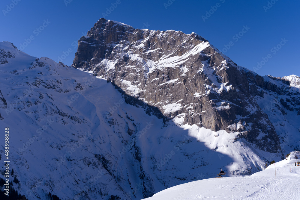 Famous Mount Titlis 3,238 meters above sea level at ski resort Engelberg in the Swiss Alps on a sunny winter day. Photo taken February 9th, 2022, Engelberg, Switzerland. Famous Mount Titlis 3,238 meters above sea level at ski resort Engelberg in the Swiss Alps on a sunny winter day. Photo taken February 9th, 2022, Engelberg, Switzerland.