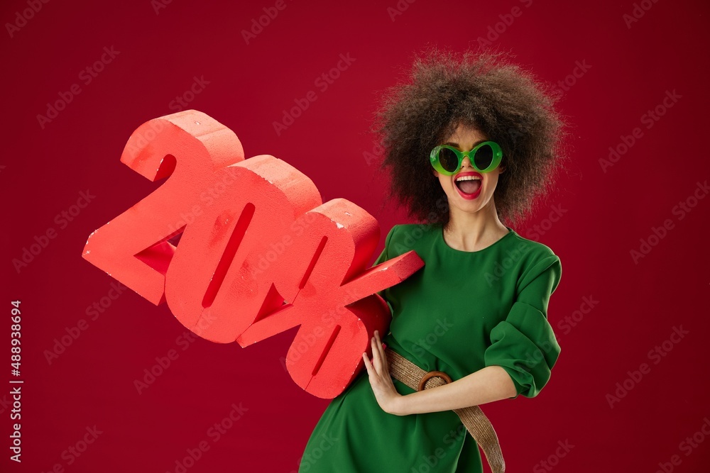 Beauty Fashion woman holding red twenty percent discount advertising color background unaltered Beauty Fashion woman holding red twenty percent discount advertising color background unaltered