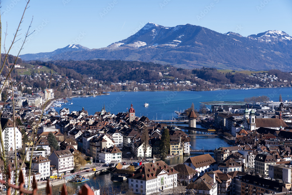 Aerial view over City of Luzern seen form local mountain Gütsch on a sunny winter day, focus on background. Photo taken February 9th, 2022, Lucerne, Switzerland.