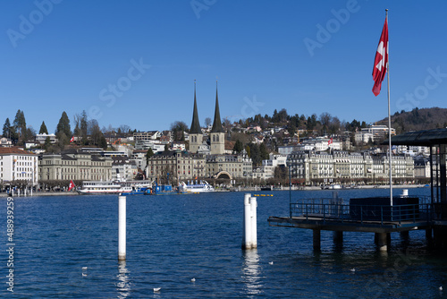 Roman catholic Court Church at City of Luzern on a sunny winter day with lake Luzern in the foreground  focus on background. Photo taken February 9th  2022  Lucerne  Switzerland.