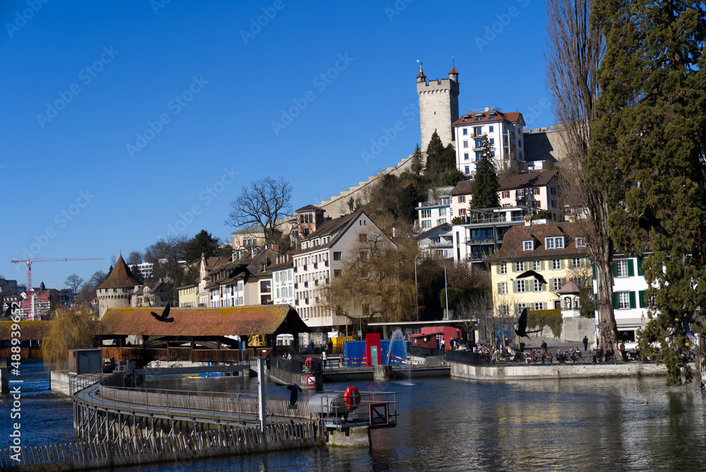 Medieval old town of Luzern with famous covered wooden Spreuer Bridge on a sunny winter day. Photo taken February 9th, 2022, Lucerne, Switzerland.