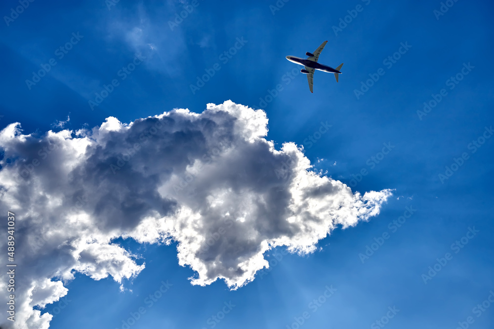 Passenger the plane flying above the white clouds. Passenger transportation by air. Travel by plane. Passenger the plane flying above the white clouds. Passenger transportation by air. Travel by plane.