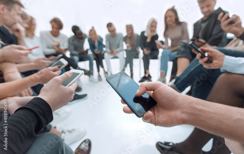 close up. groups of young people with smartphones.