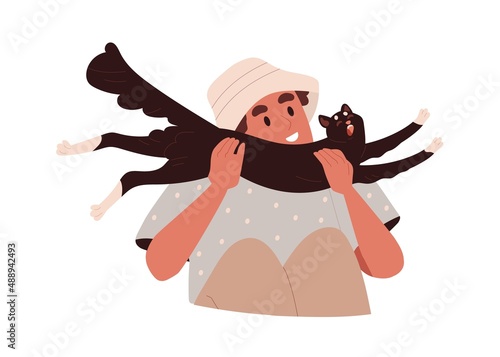 Happy person holding funny cat in hands with love. Pet owner and cute adorabl...