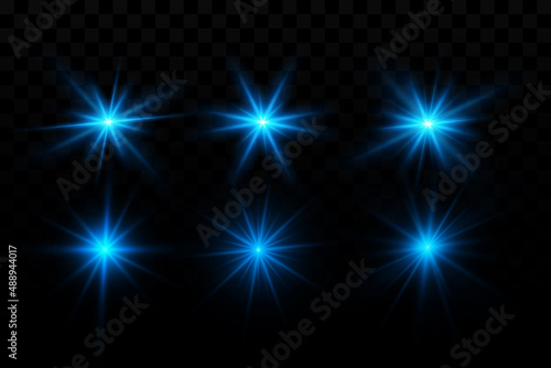 Bright blue sparkling particles. Background decoration. Blue dust. Light effect