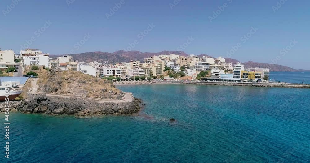 drone shot over the marina, seaside boulevard, beaches, summer in Agios Nikolaos Crete Greece drone shot over the marina, seaside boulevard, beaches, summer in Agios Nikolaos Crete Greece