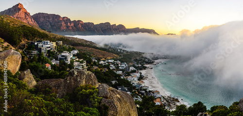 A huge cloud over the Camps Bay in Cape Town during sunset.