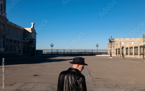 Adult man in hat and leather jacket on square. Madrid, Spain © WeeKwong