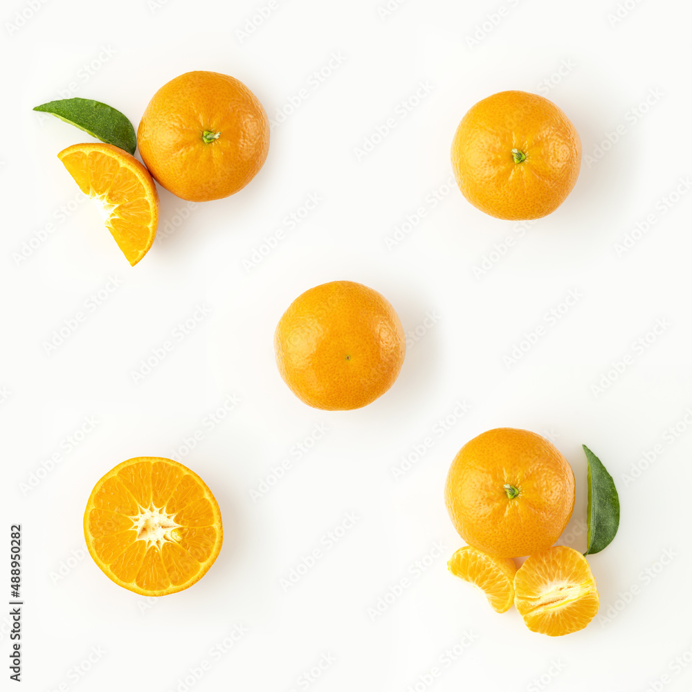 Fresh ripe whole and sliced mandarin, tangerine or clementine isolated on white background Fresh ripe whole and sliced mandarin, tangerine or clementine isolated on white background