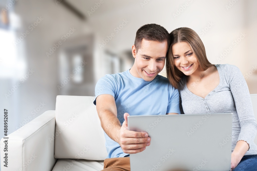 Overjoyed couple of friends using laptop, shopping online, playing game looking at digital screen. Overjoyed couple of friends using laptop, shopping online, playing game looking at digital screen.
