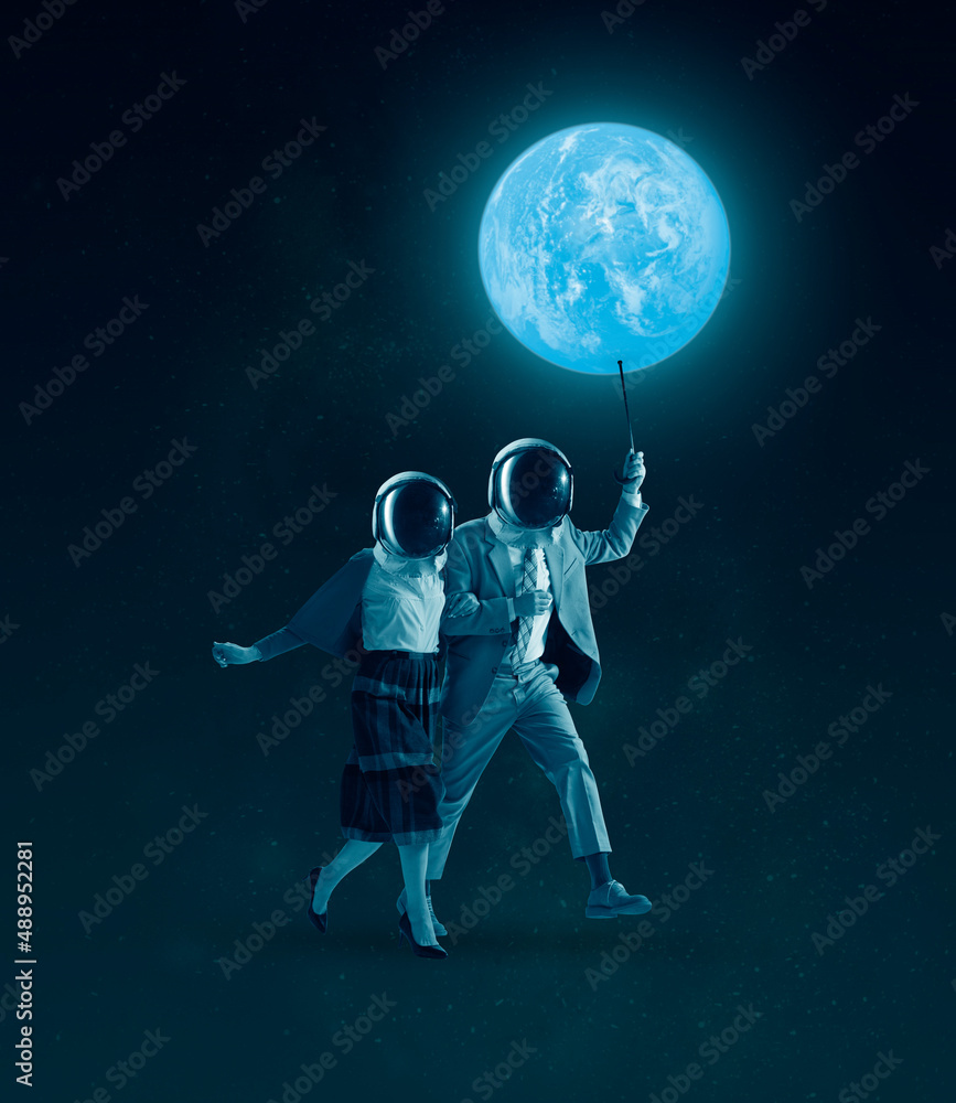 Composition with man and woman wearing retro outfits and helmets walking under the starry night sky. Concept of astronautics, dreams, Day of Human Space Flight