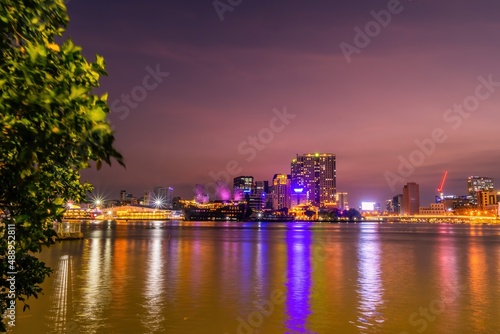 Enjoy the Nha Rong wharf and Ben Nghe canal afternoon in Ho Chi Minh City (Saigon). Colorful Saigon river at night.