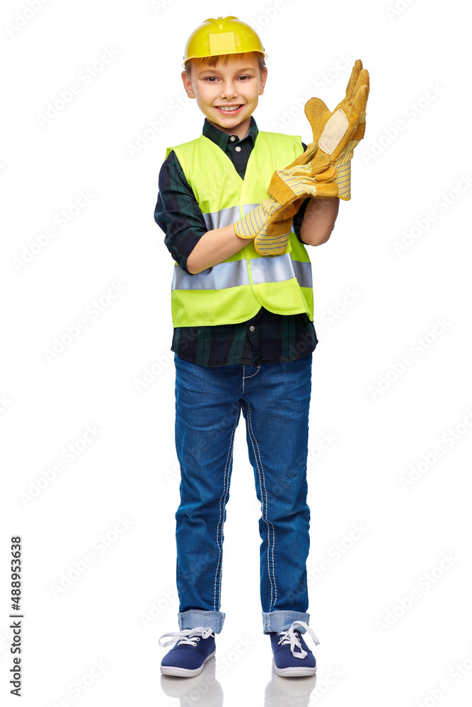 building, construction and profession concept - happy smiling little boy in protective helmet, gloves and safety vest over white background building, construction and profession concept - happy smiling little boy in protective helmet, gloves and safety vest over white background