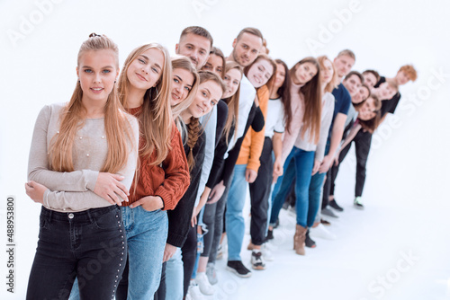 group of happy young people standing in line