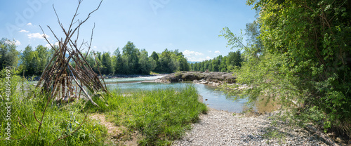 Schilderij op canvas riparian zone Isar river with wooden tent and gravel banks, panorama landscape b