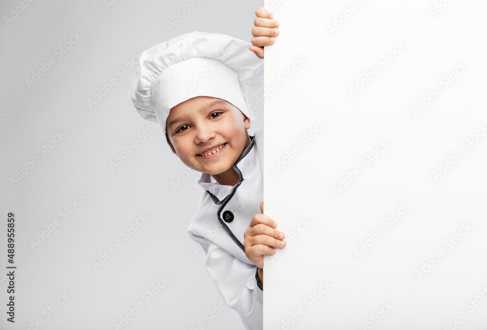 cooking, culinary and profession concept - happy smiling little girl in chef's toque and jacket with white board over grey background - obrazy, fototapety, plakaty 