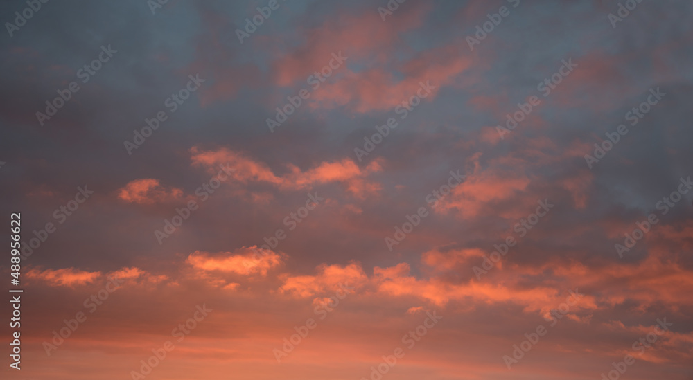 sunset scenery, grey sky with pink lighted clouds