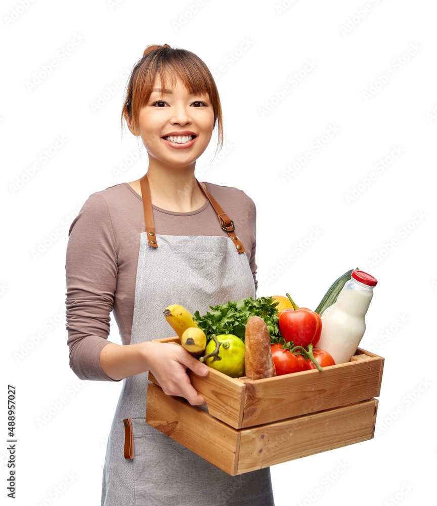 cooking, culinary and people concept - happy smiling female chef in apron with food in wooden box over white background cooking, culinary and people concept - happy smiling female chef in apron with food in wooden box over white background