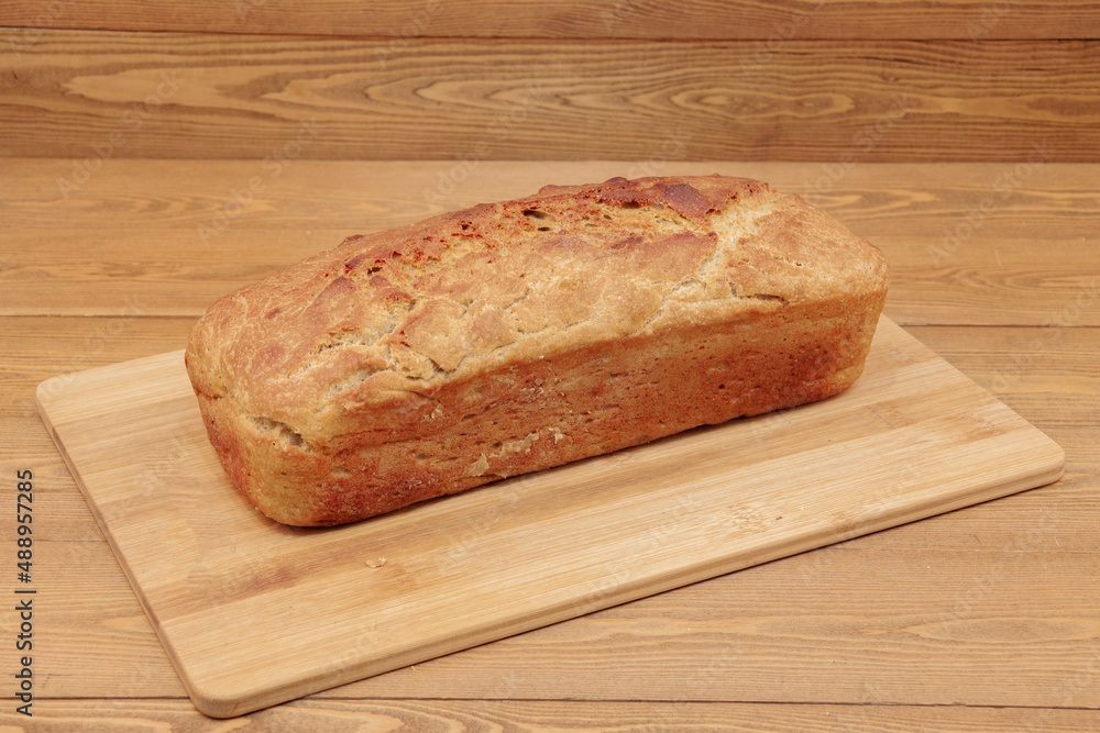 A loaf of bread. A loaf. Wheat products. Russian food. Close-up. A loaf of bread. A loaf. Wheat products. Russian food. Close-up.