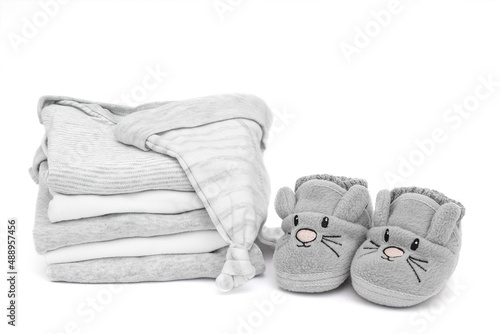 Stack Baby clothes for newborn boy isolated on a white background.