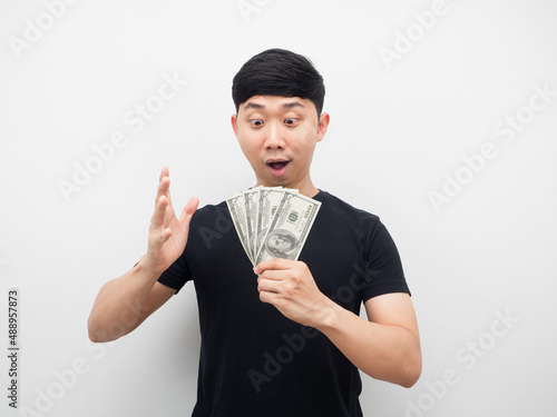 Man feeling surprised about money in his hand