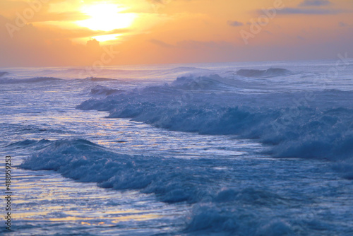 beautiful waves and clouds on the ocean shore 