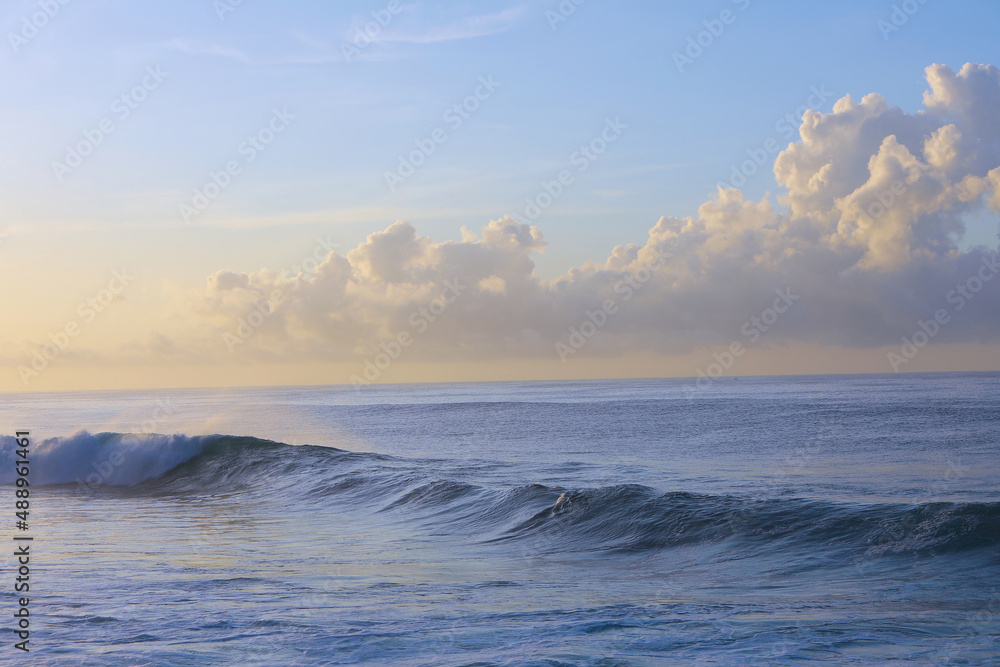 beautiful waves and clouds on the ocean shore 