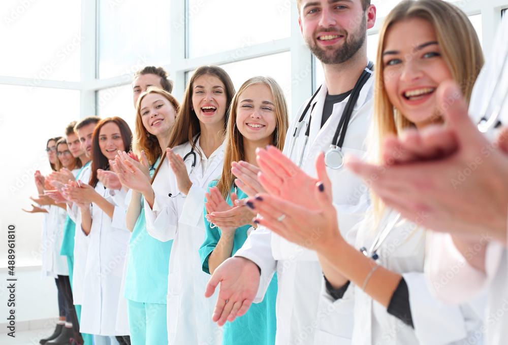 top view. a group of smiling doctors pointing at you. top view. a group of smiling doctors pointing at you.