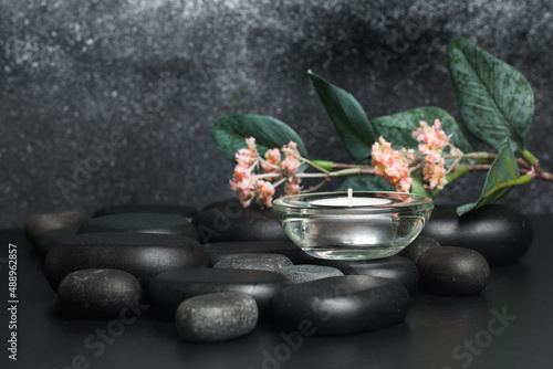 Spa stones  and candle on black background - Image