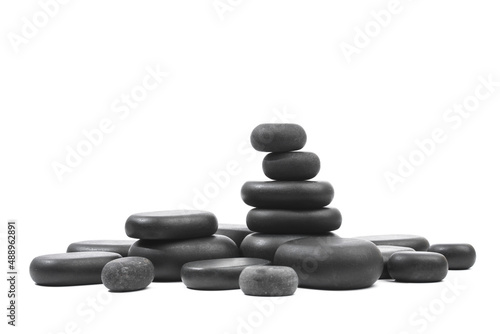 black spa stones isolated on white background .