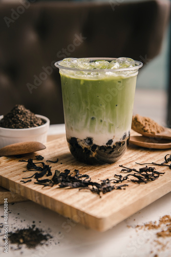 cup of green tea with boba photo