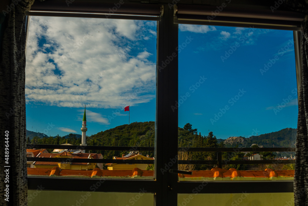 Fototapeta premium MARMARIS, TURKEY: View from the window of the mosque and hotels with apartments in Marmaris.