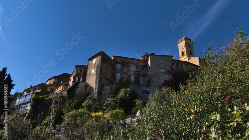 Low angle view of the historic center of small village Eze located on a rock at the French Riviera on a sunny day in autumn season with church. photo